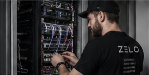 Technician working on an AV rack installation