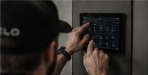 Technician configuring a smart home control panel